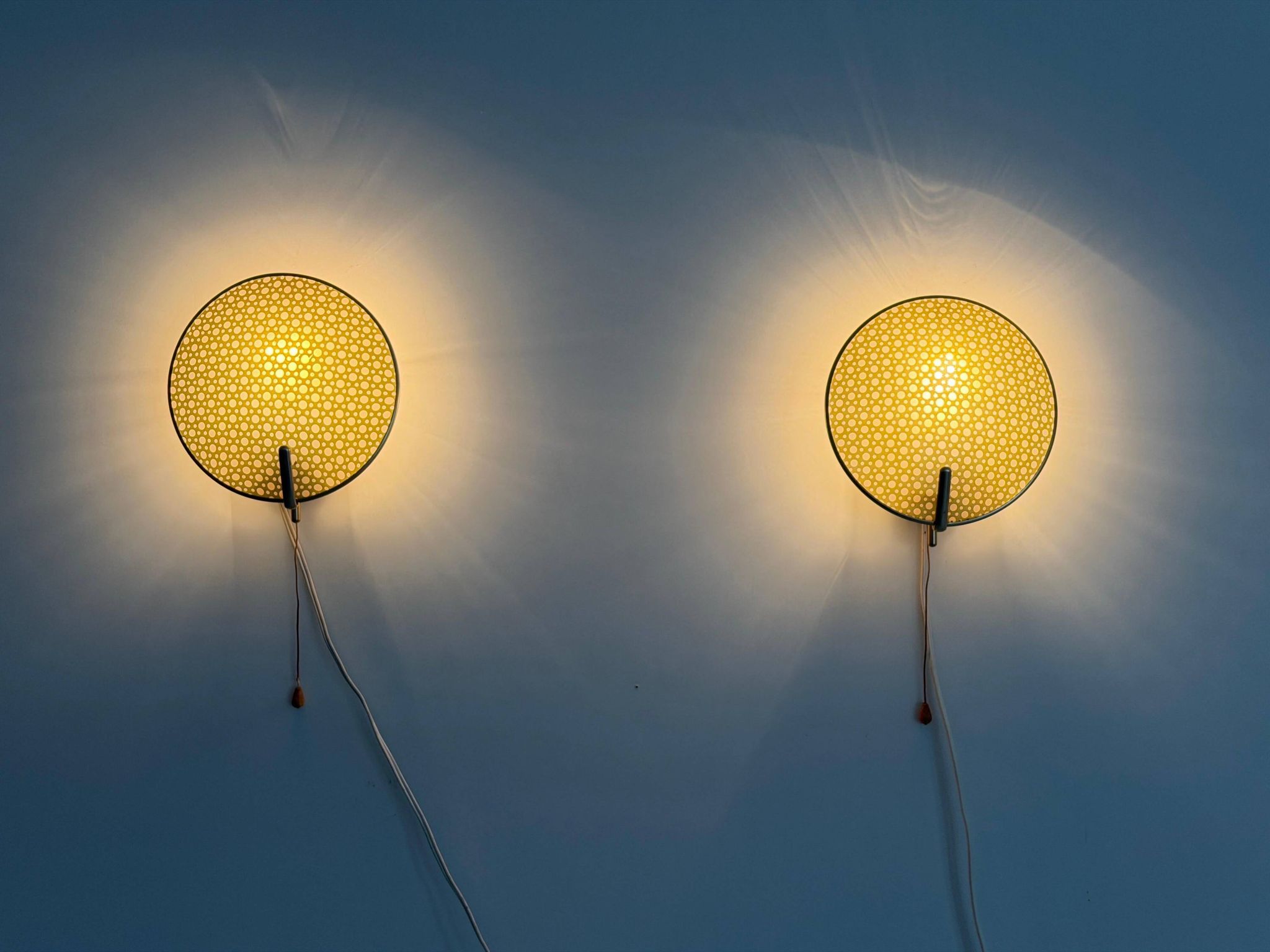 Pair of green plexiglass and gold metal wall lights by Erco, 1950s, Germany.