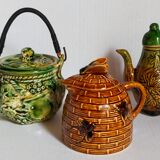 Set of old teapots and honey pot