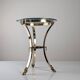Neoclassical side table in brass and bevelled glass with ram's heads, 1970s.