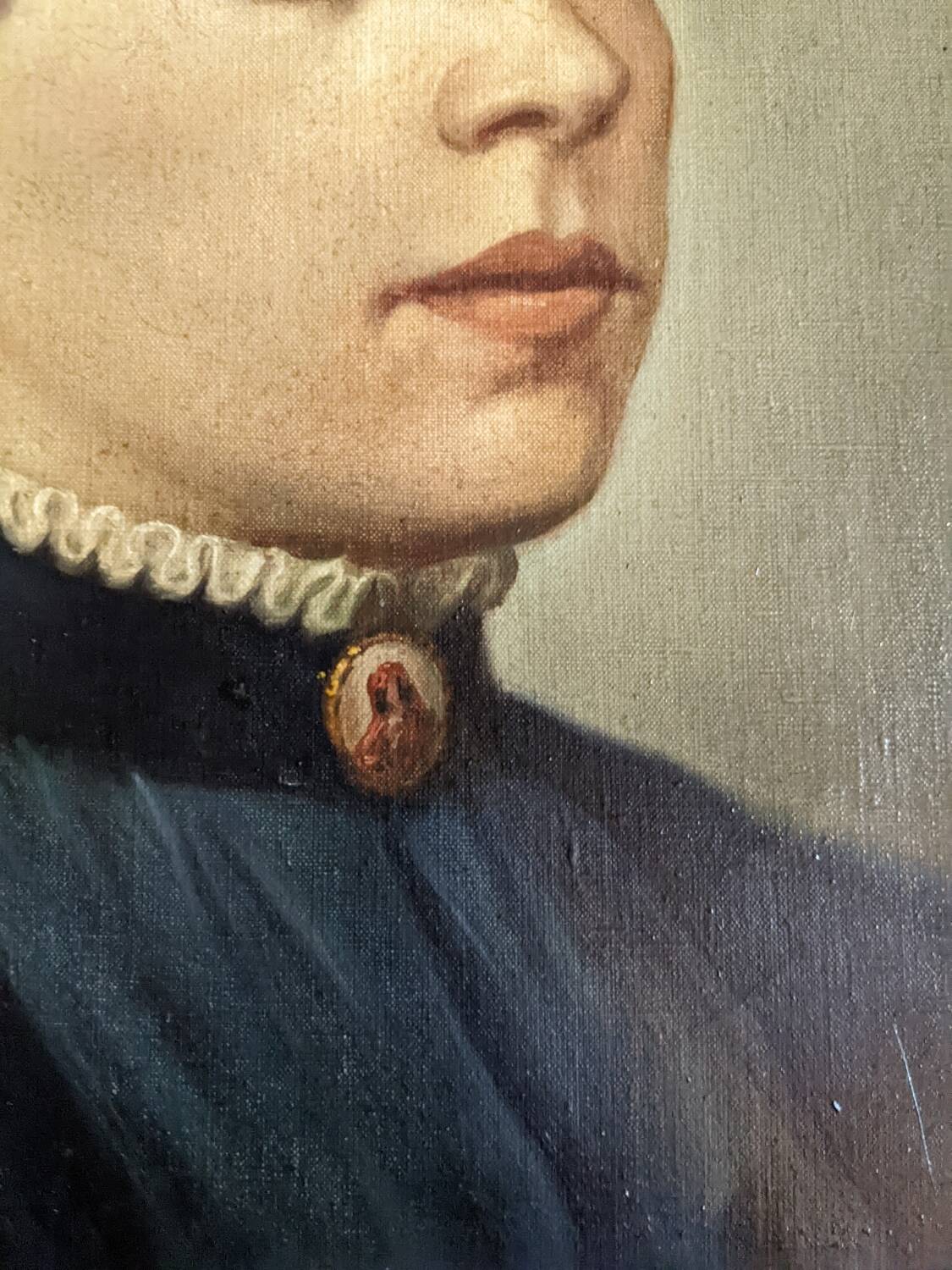 Oil on canvas portrait in an antique gilded wooden frame.