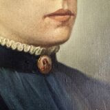 Oil on canvas portrait in an antique gilded wooden frame.