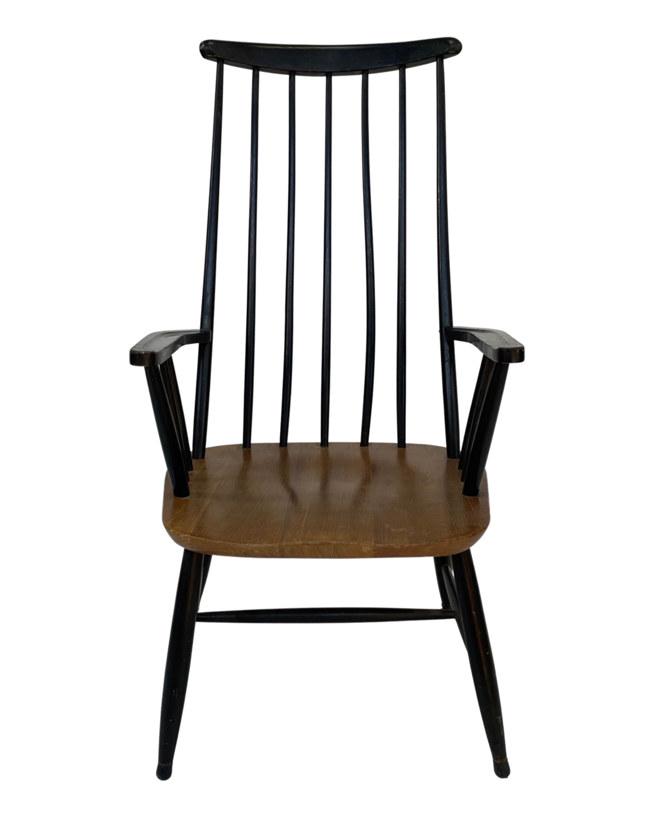 Vintage easy chair with high back and armrest from the 60s