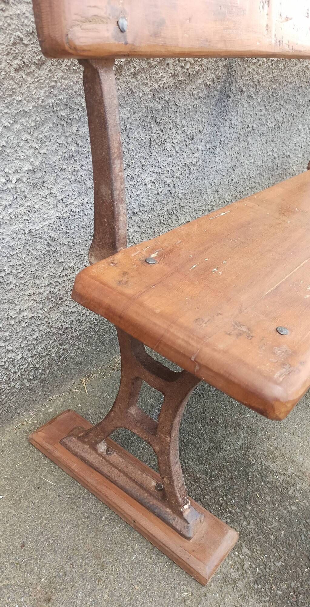 Old wooden bench with cast iron base