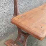 Old wooden bench with cast iron base