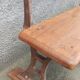Old wooden bench with cast iron base