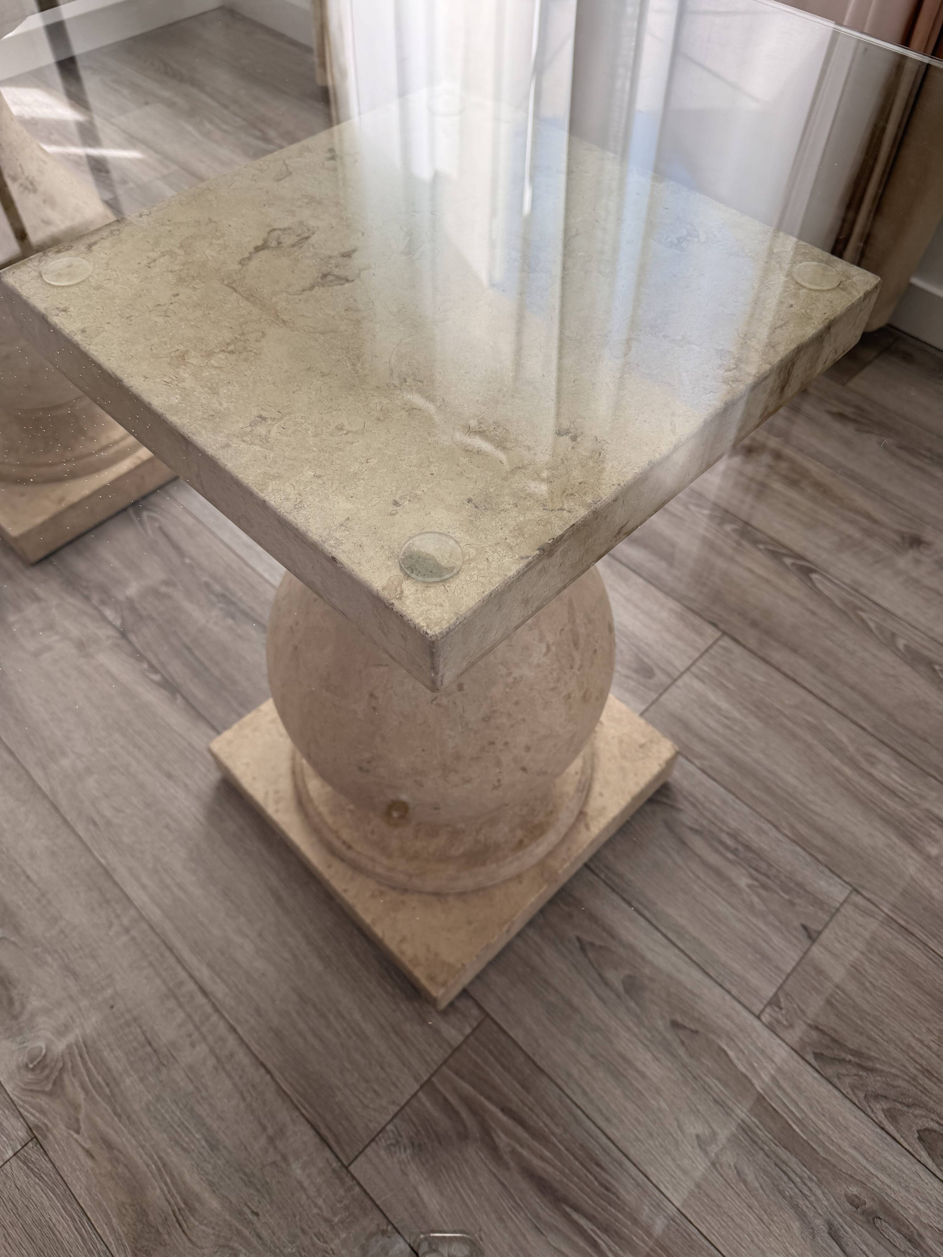 Table with a glass top and 8 chairs.