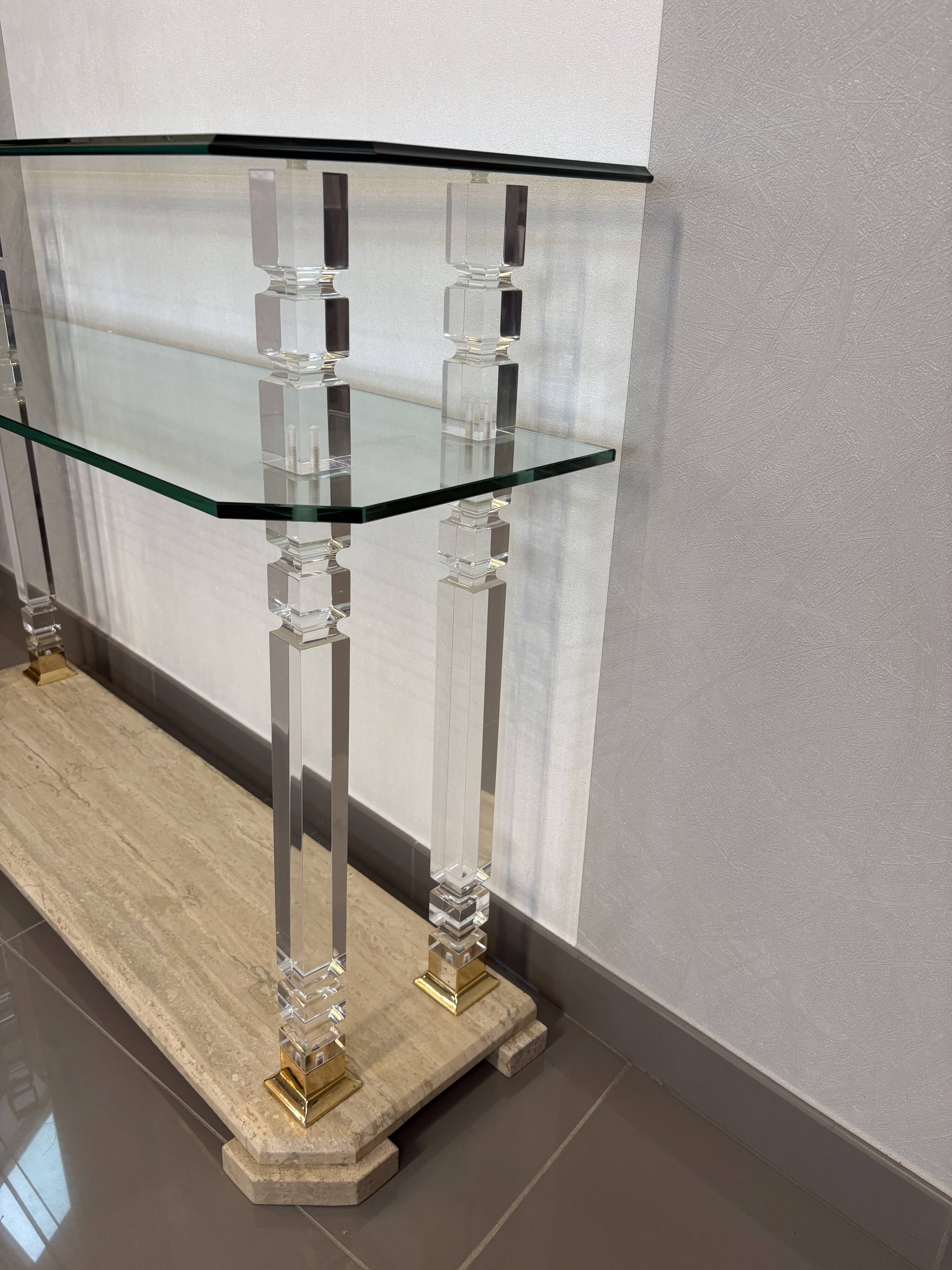 Hollywood Regency console style in travertine, glass, and Lucite.