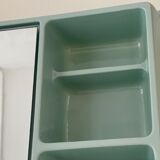 Baby blue plastic mirror and wash station