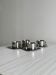 set de 4 tasses à café inox empilables avec soucoupes
