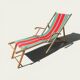 Vintage deck chair with striped green and red fabric, original patina.