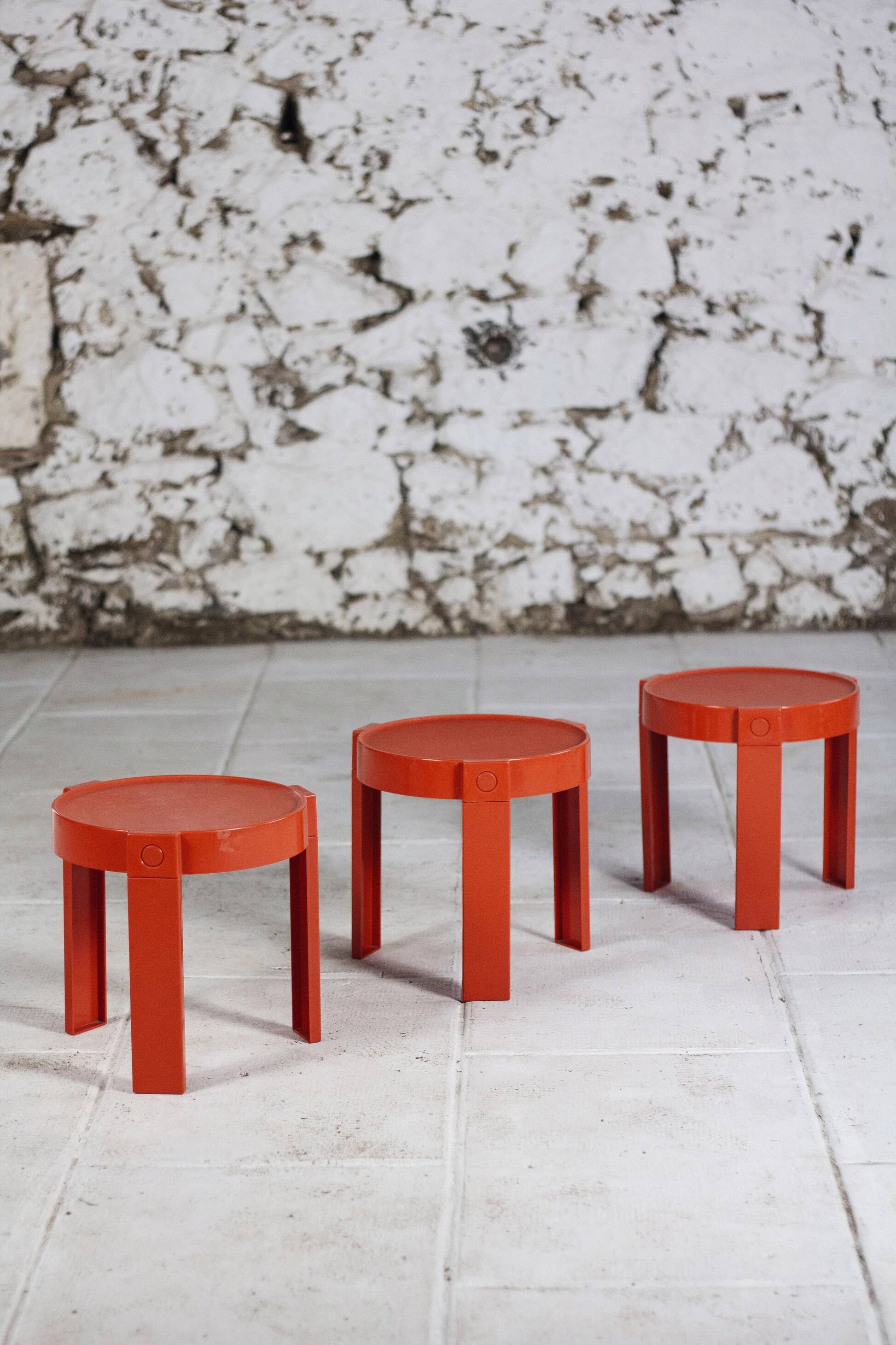 3 nesting tables in orange plastic by Prisunic, 1970.