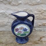 Blue ceramic vase with floral motifs