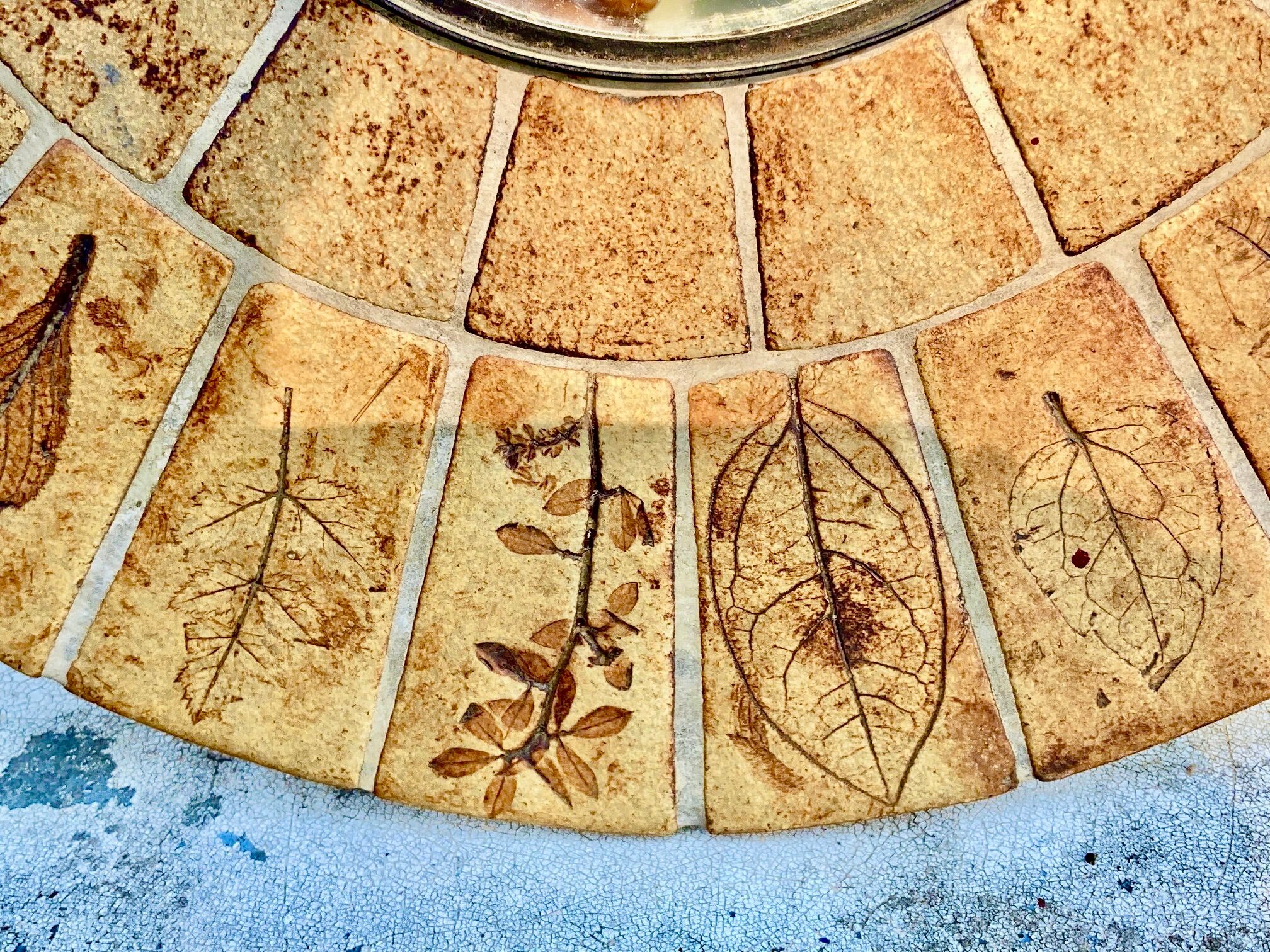 Round ceramic mirror decorated with leaves, signed Roger Capron, 50