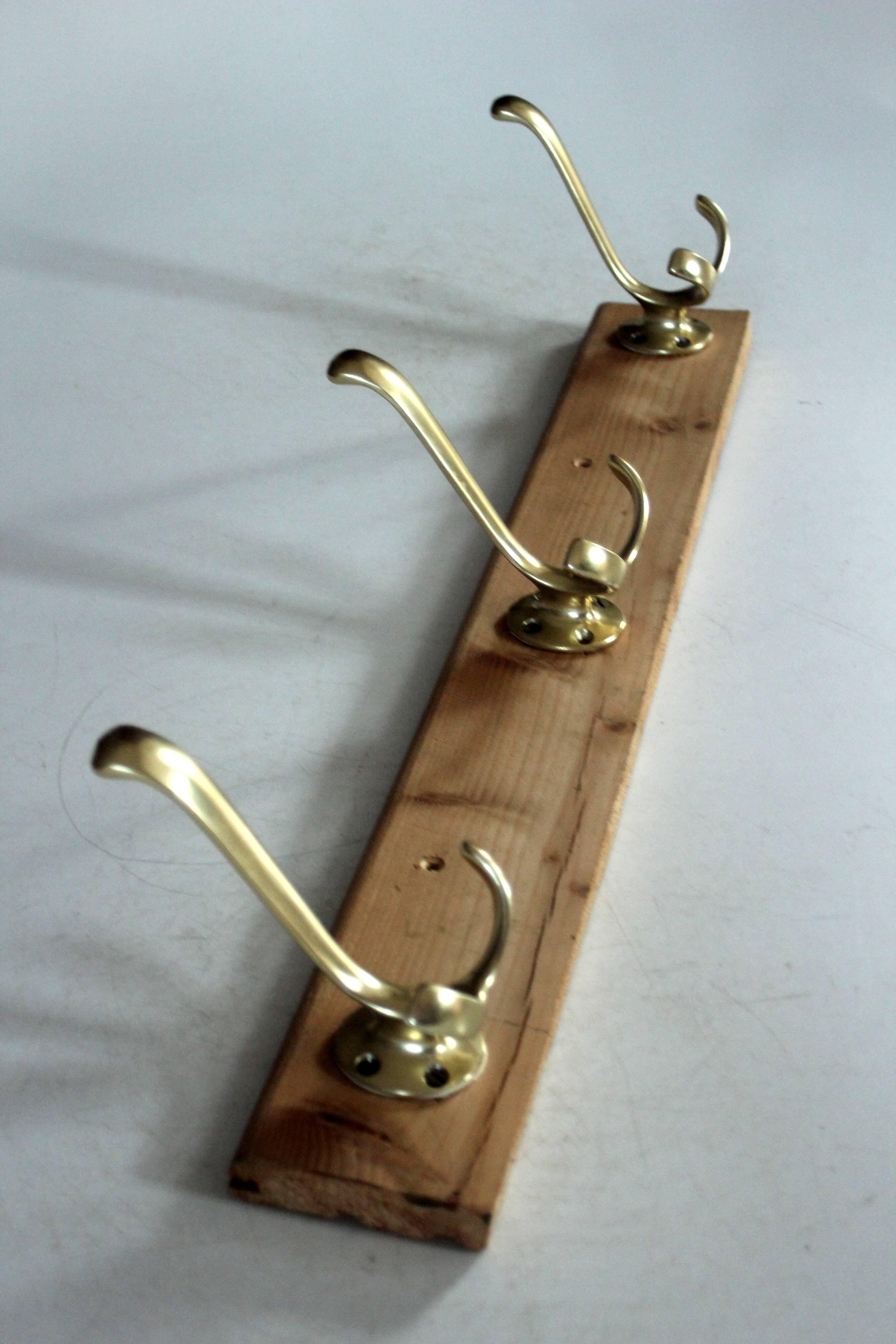 Wall mounted wooden coat rack with 3 brass hooks, vintage from the 50s
