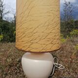 Vintage ceramic table lamp and golden lampshade.