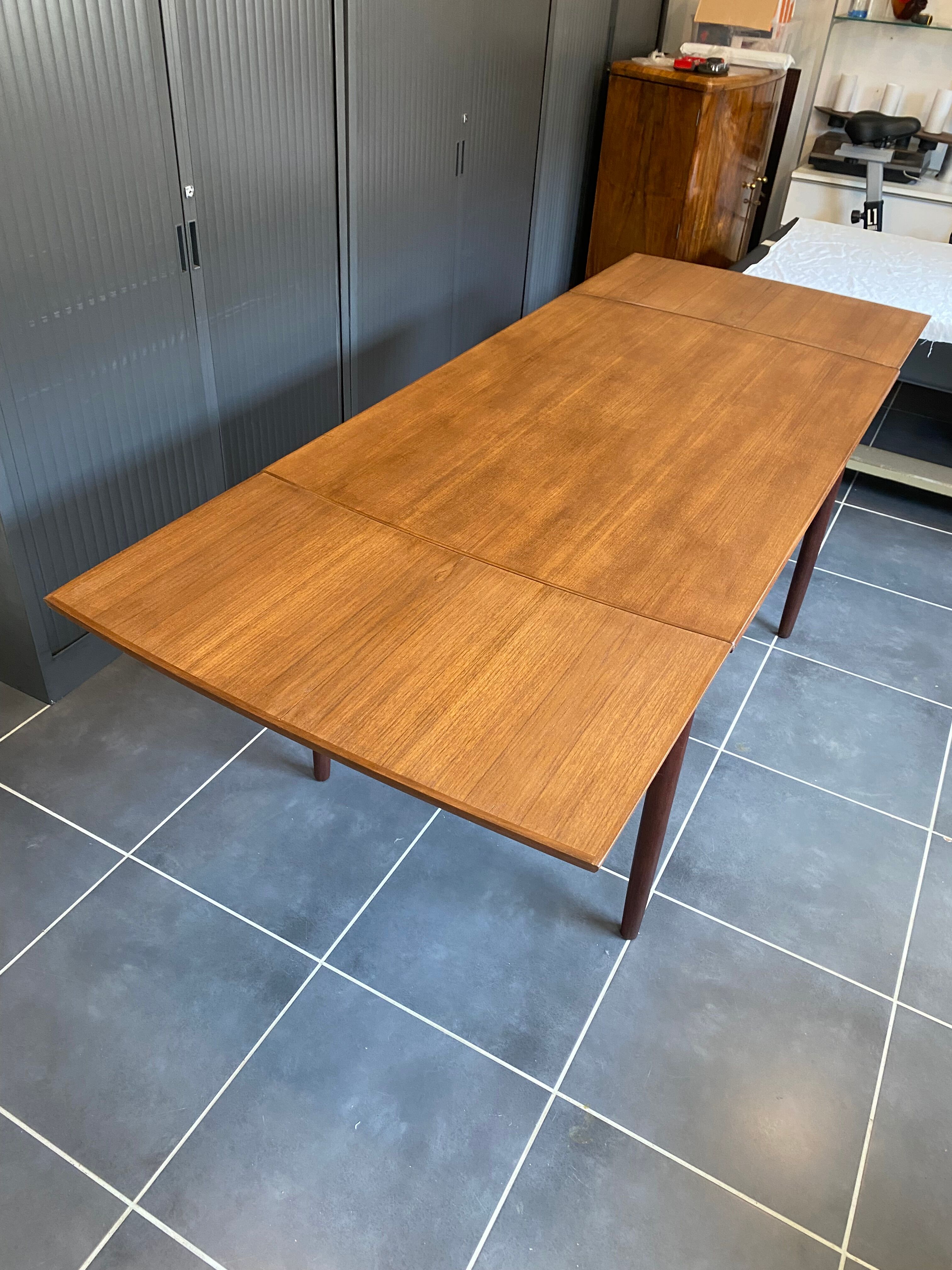 Extendable Scandinavian teak table by Johannes Andersen for Samcom Denmark.