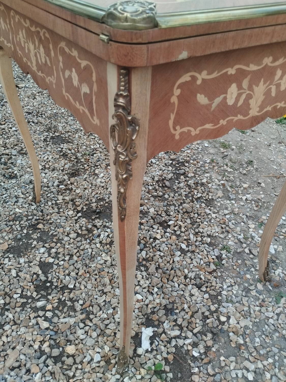 Antique game table in Louis XVI style with marquetry.