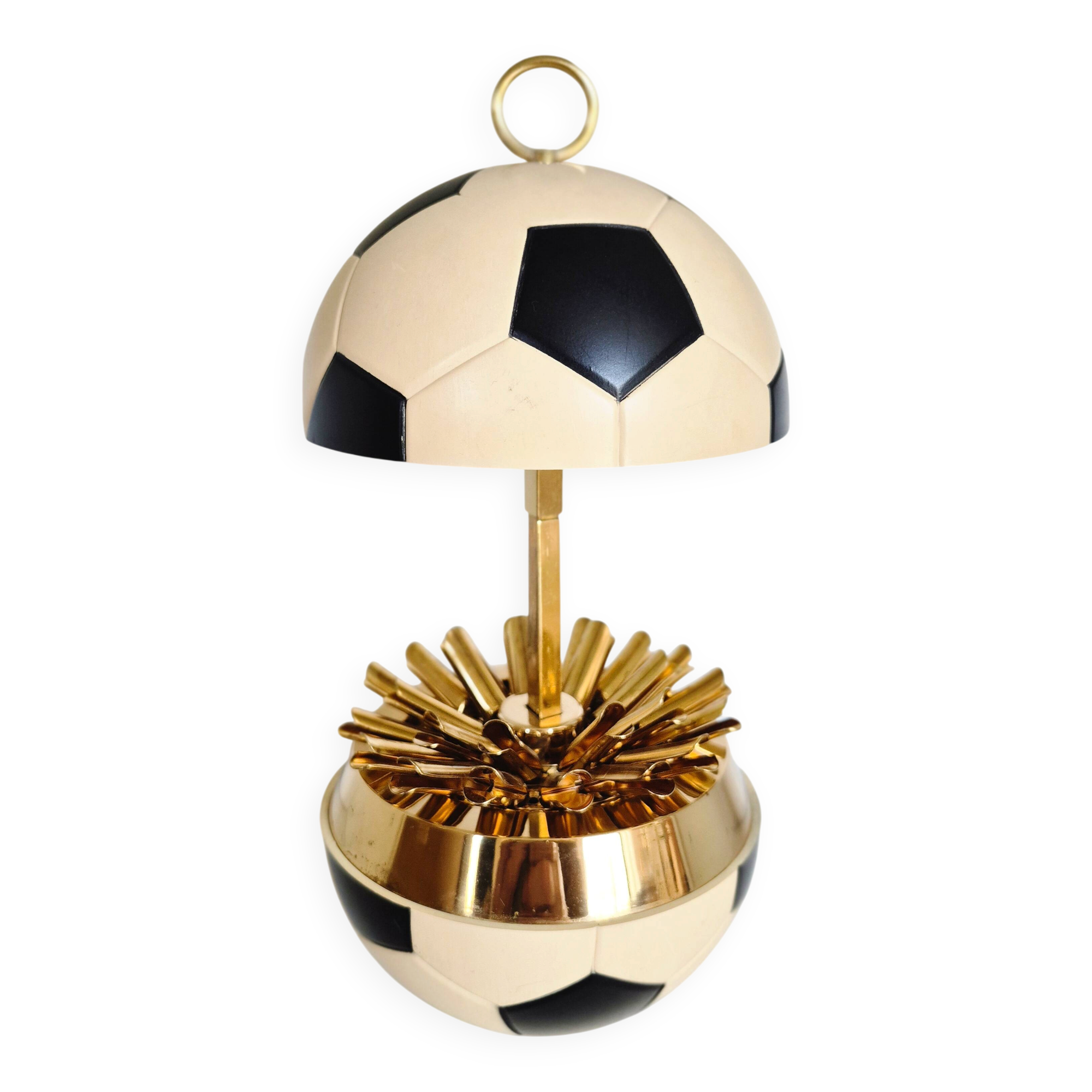 Vintage cigarette dispenser in the shape of a football.