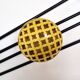 Black and yellow wall coat rack, France