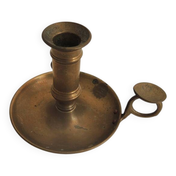 Old hand-push brass candlestick