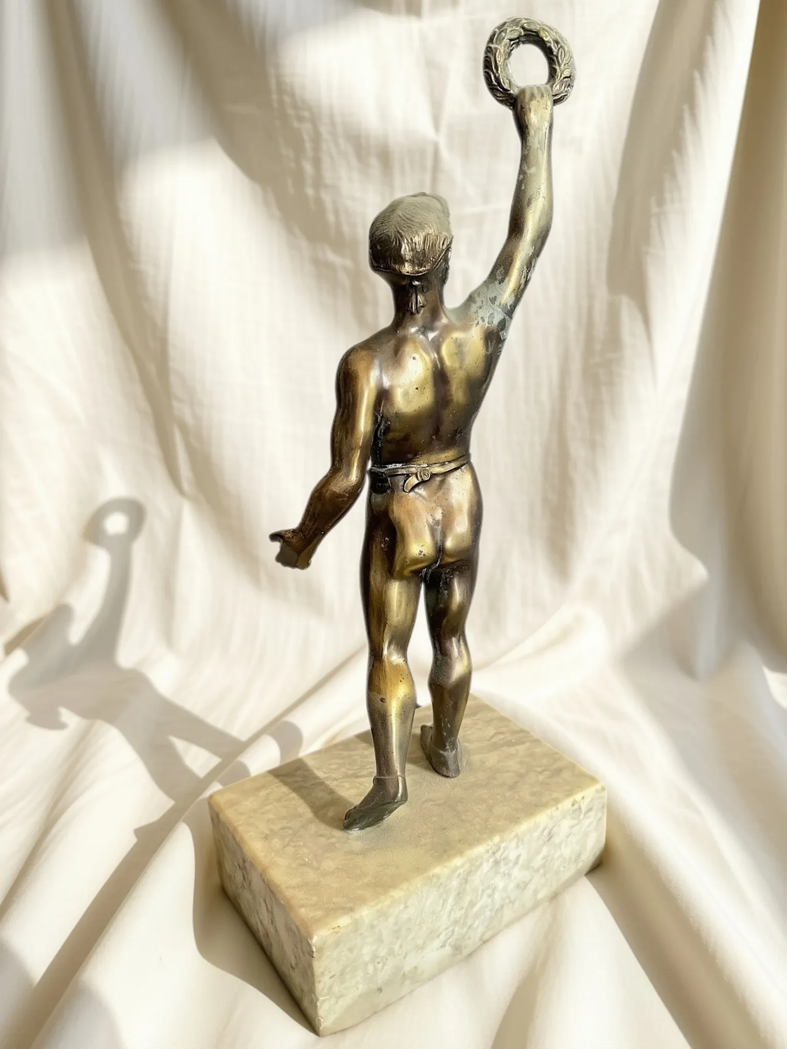 Antique bronze sculpture on a marble base, Roaring Twenties, around 1930.