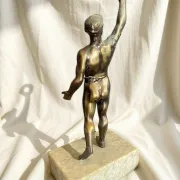 Antique bronze sculpture on a marble base, Roaring Twenties, around 1930.