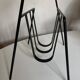 Modernist magazine rack French work 1950 in iron and brass