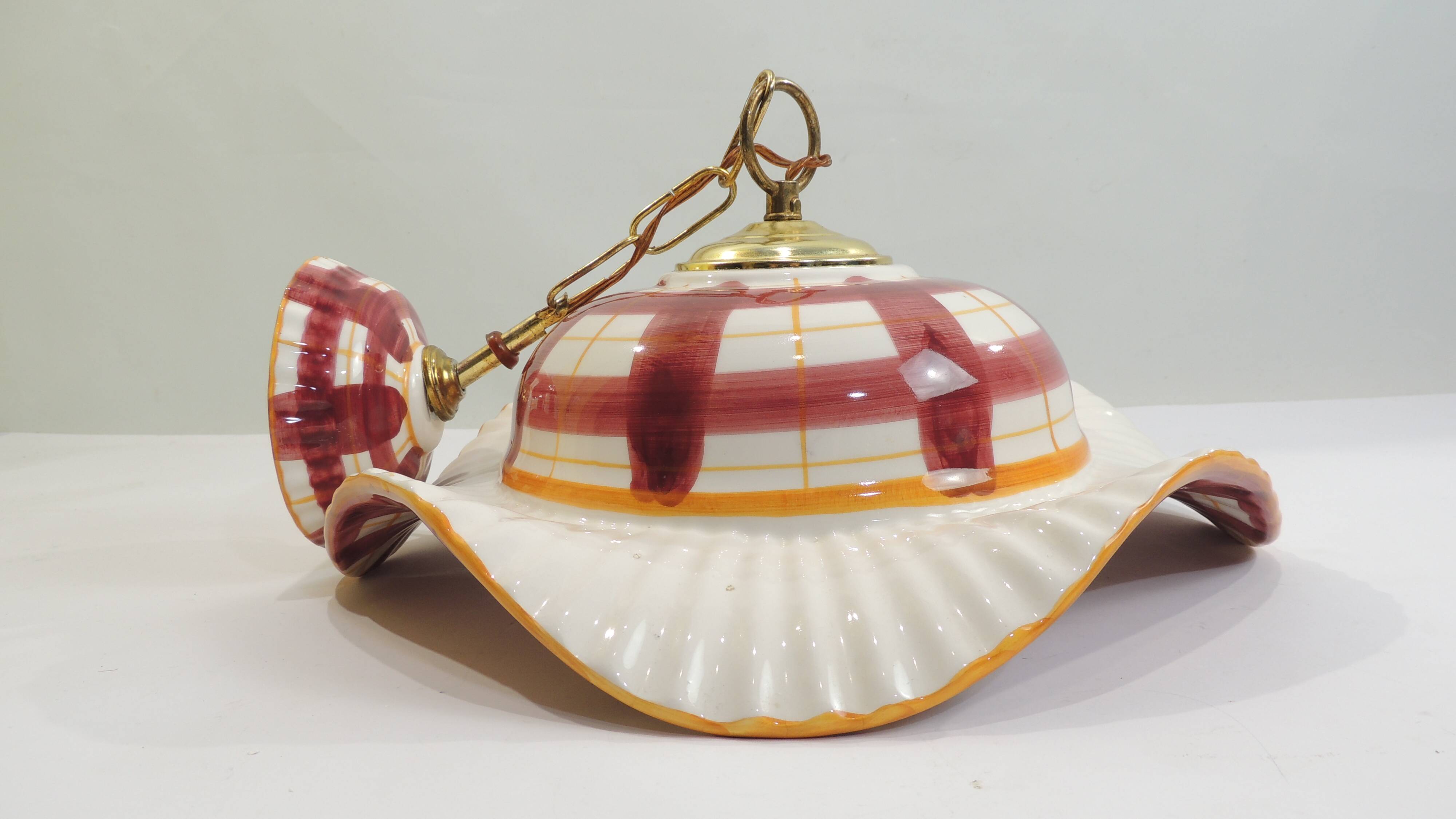 Vintage earthenware pendant light with a burgundy and ochre tartan pattern