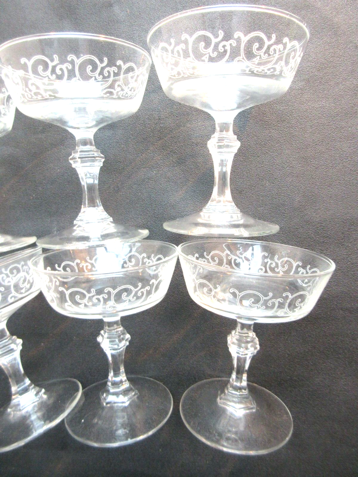 6 Louis XV style champagne glasses engraved with arabesques, baluster foot