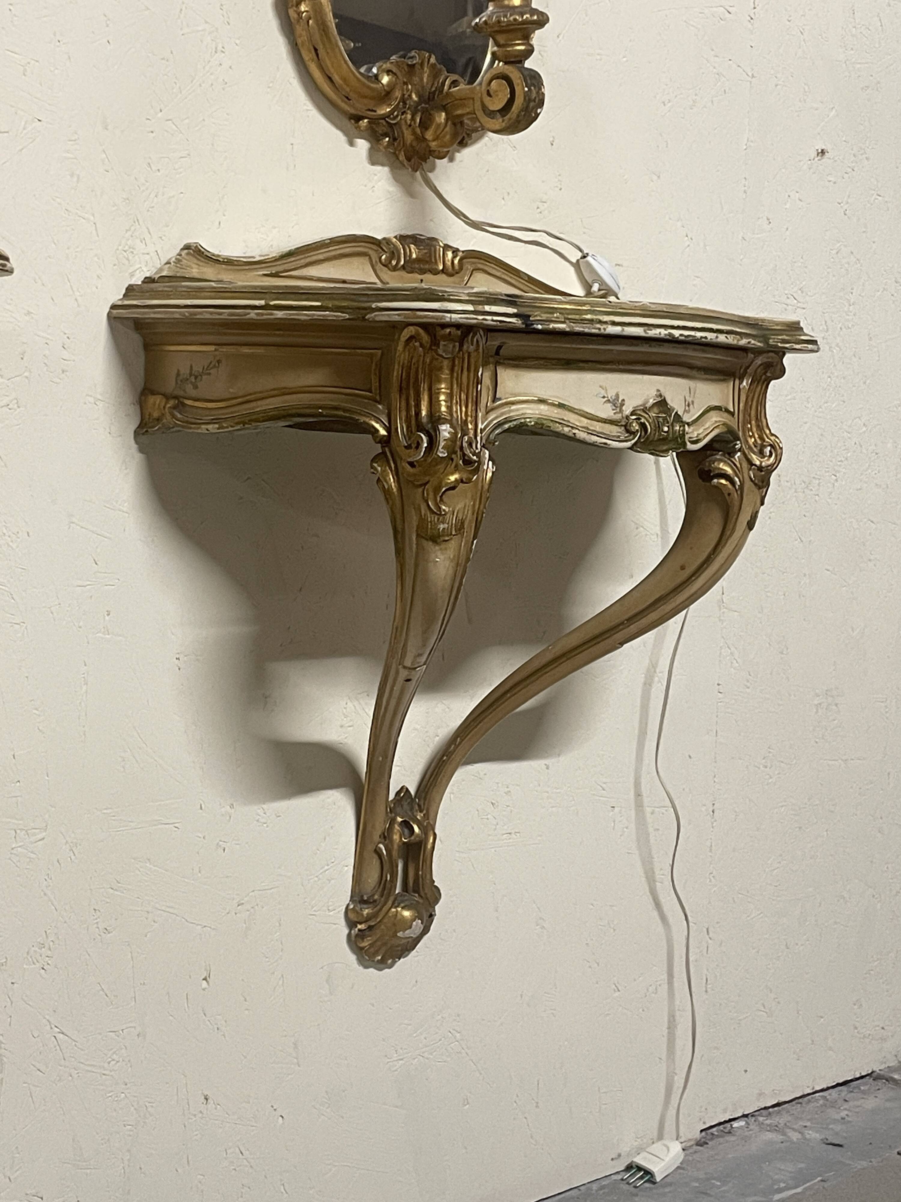 Pair of wall-mounted consoles with a mirror in Louis XV style.