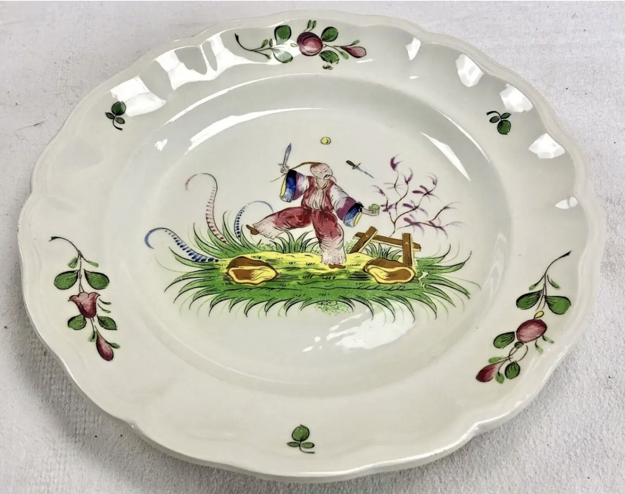 Hollow round dish décor with Chinese Saint Clément Lunéville