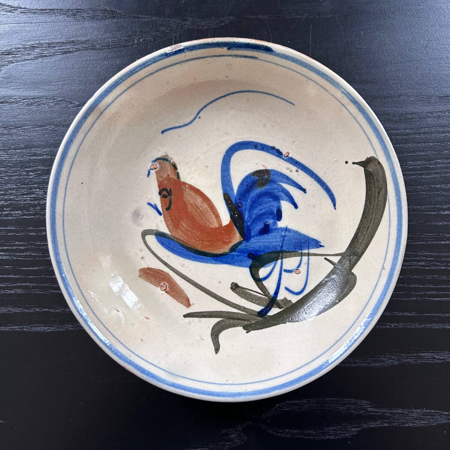 Antique dish with bird decoration