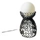 Handcrafted wrought iron lamp with a white opaline globe.