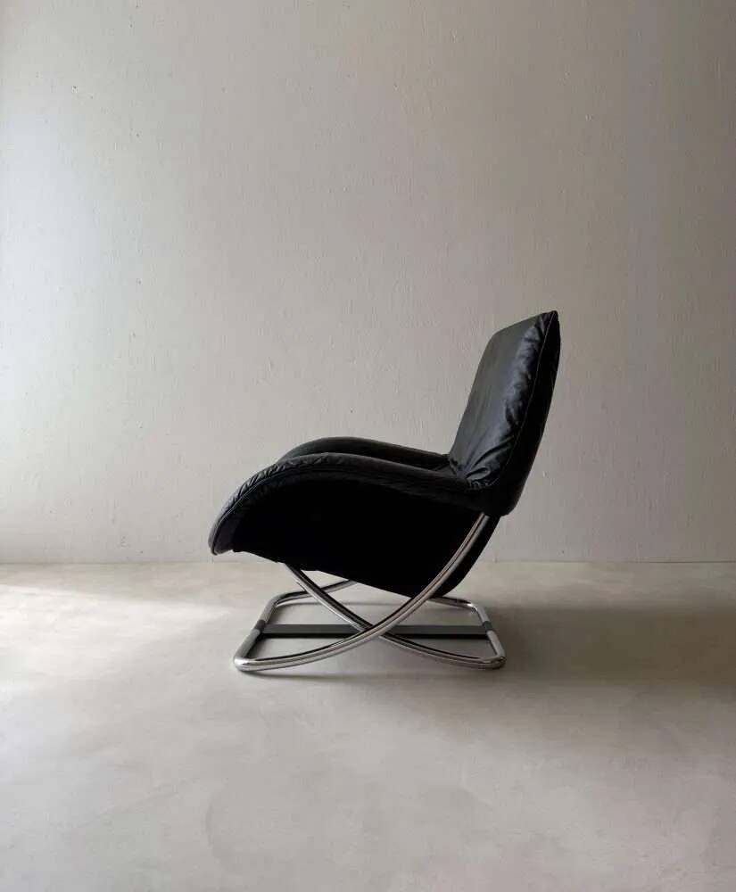 Swiss lounge chair with ottoman by Robert Haussmann from the 1980s.