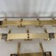 Three vintage 1960s gold coat racks with 4, 3 and 2 hooks