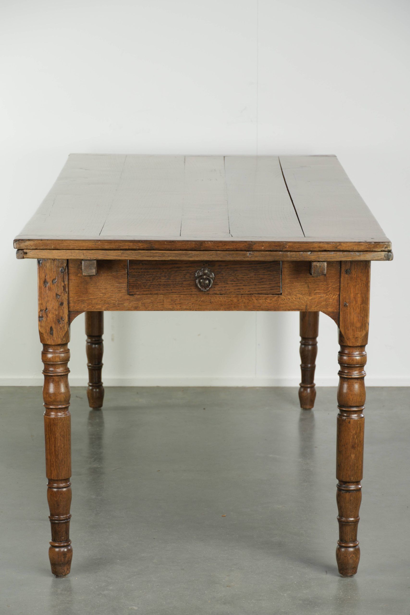 Antique oak dining table from the late 18th century with extendable leaves