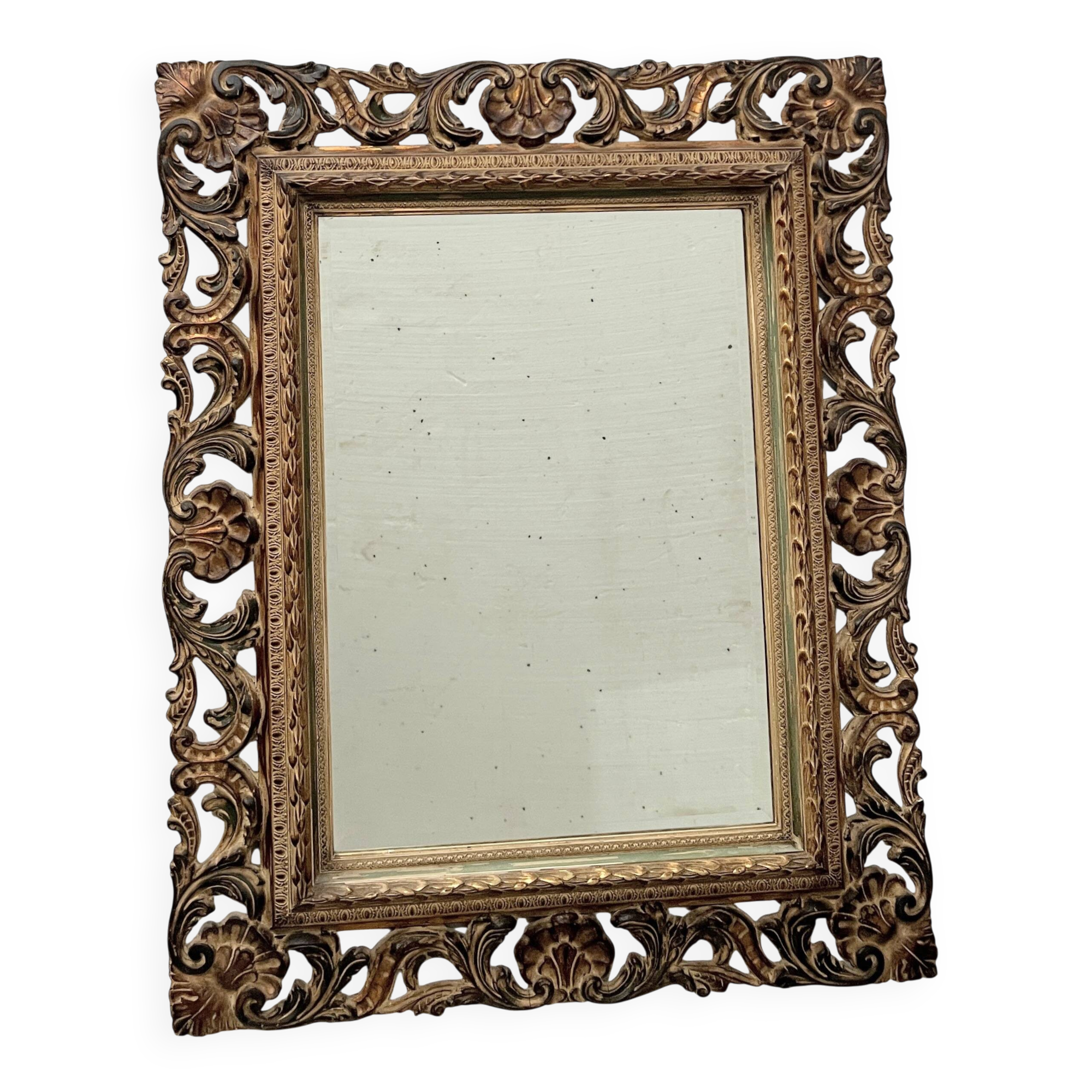 Napoleon III style mirror in carved wood, 20th century.