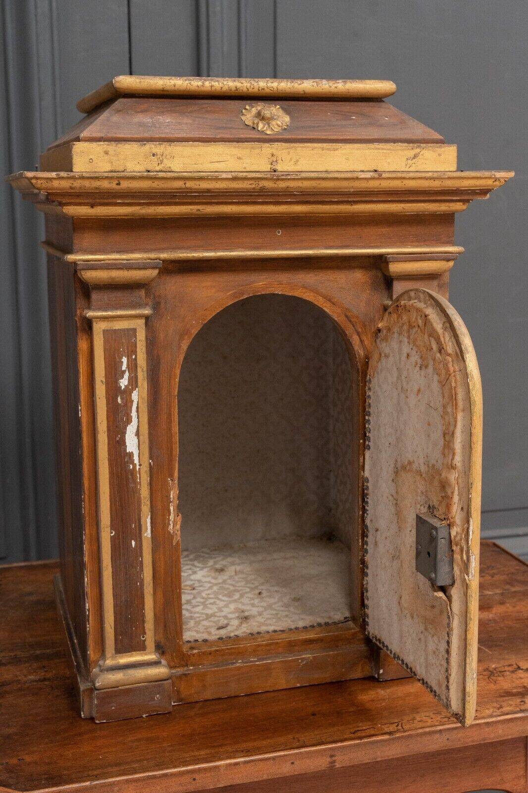 18th century tabernacle decorated with 2 columns and a sun on the facade