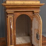 18th century tabernacle decorated with 2 columns and a sun on the facade