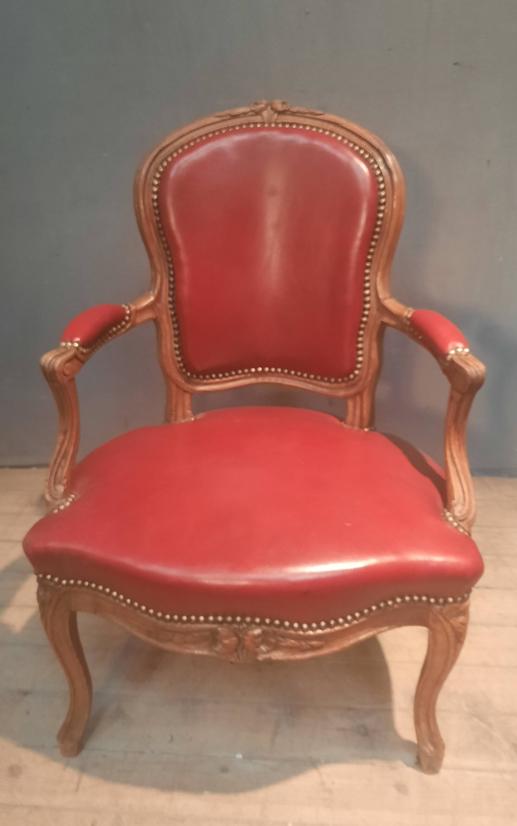Louis XV period armchair covered in leather.