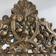 Small mirror with brass parcloses in repoussé style Louis XIV, late 19th century.