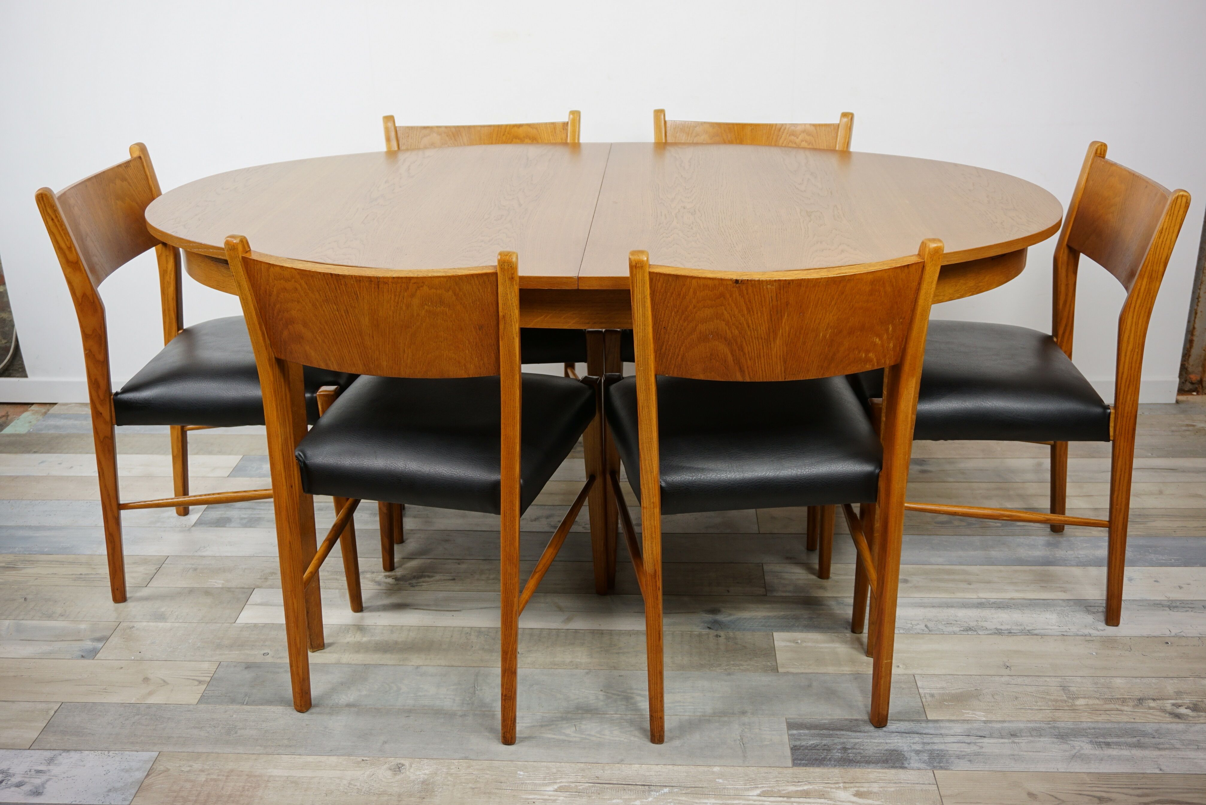 Wooden oval table and 6 matching chairs 60