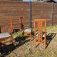 Set of 8 teak lounge chairs with high backs and zebra-striped seats