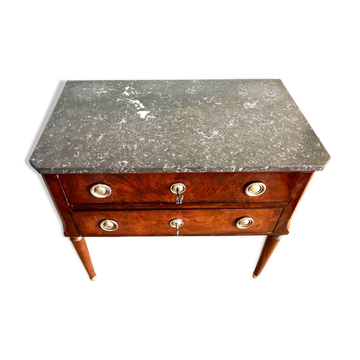 Louis XVI style wooden veneer chest of drawers with a marble top.