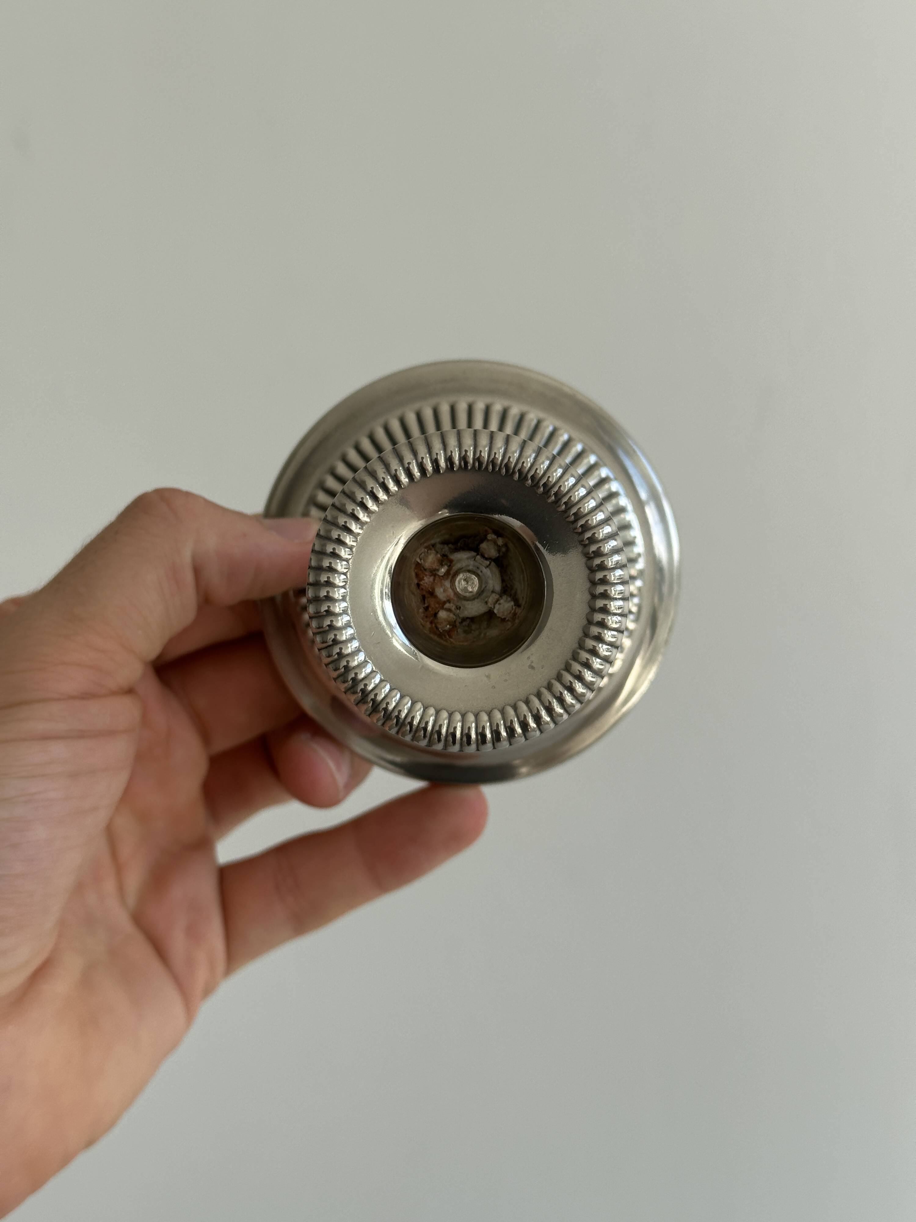 Antique patinated metal candle holder