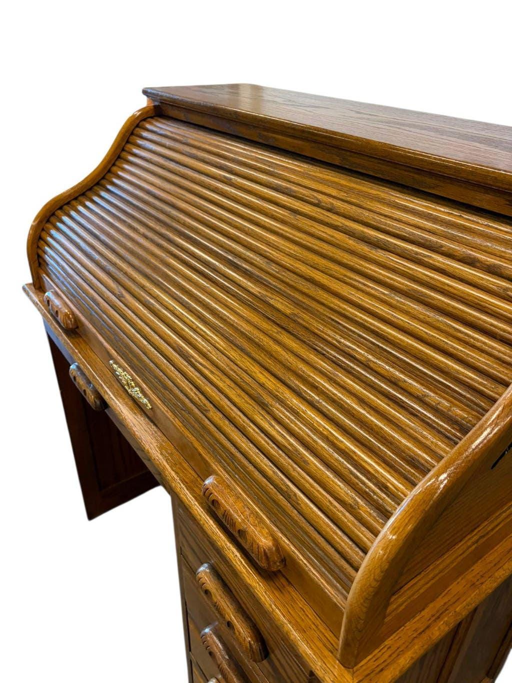 Vintage American wooden desk with a roll-top.