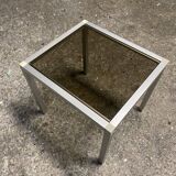 Set of coffee tables, pedestal tables and nesting tables in smoked glass and metal