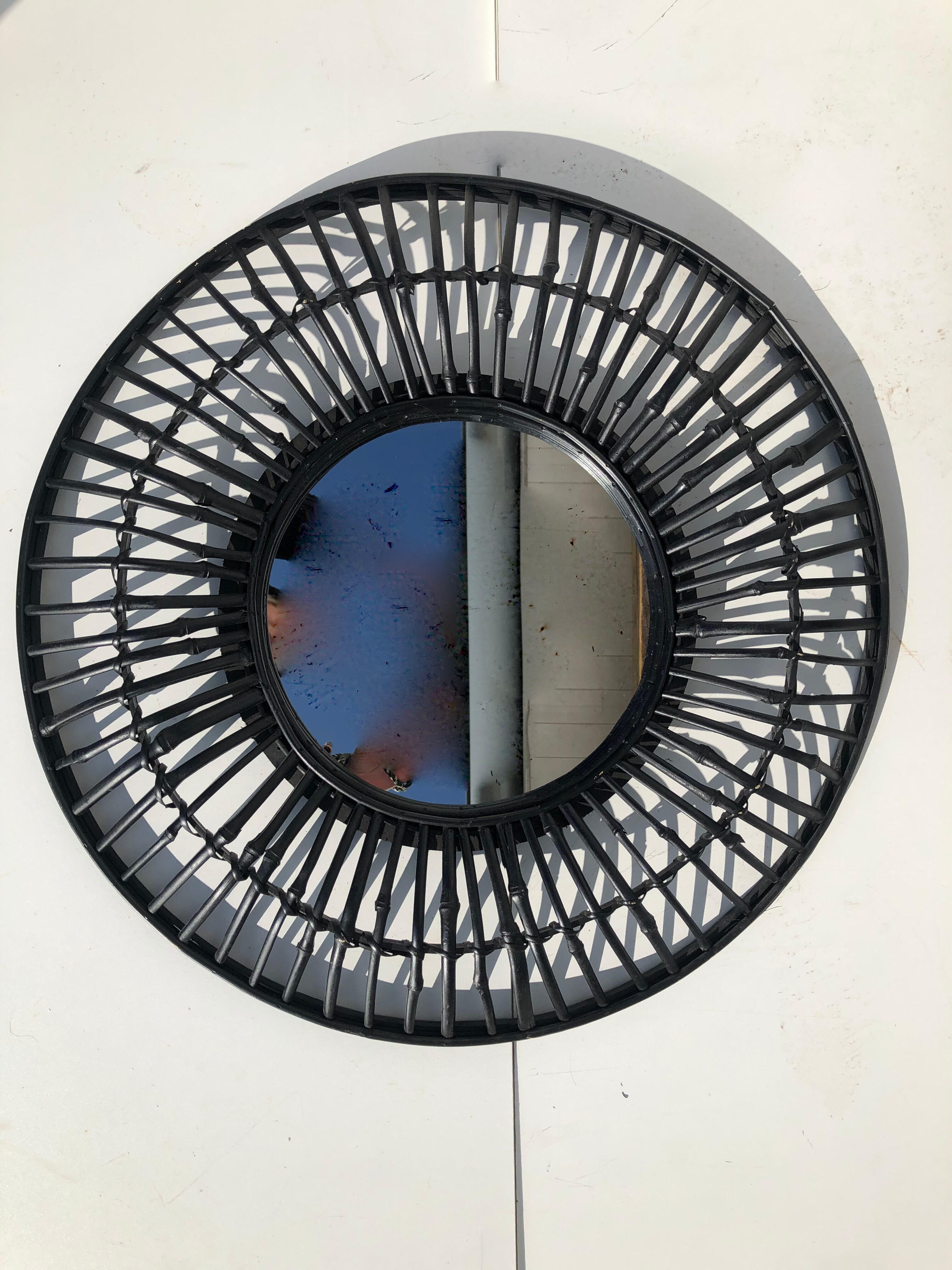 Round black rattan mirror