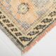 Tapis vintage à décor géométrique orange et crème