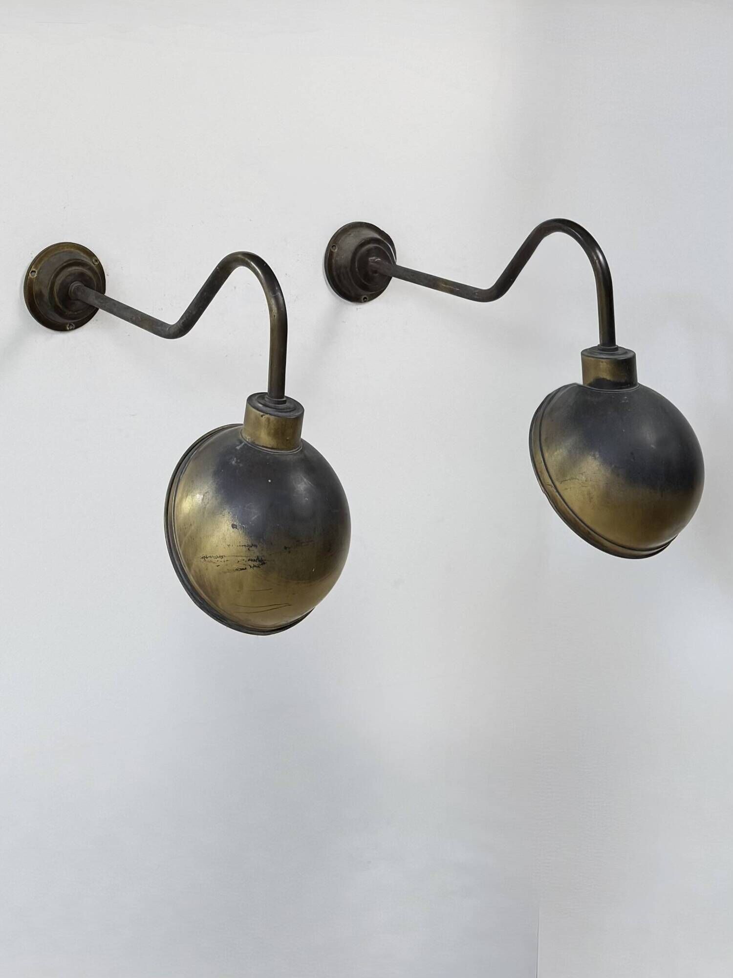Pair of XL patinated brass wall lights, France, 1970.